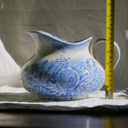 A beautiful French antique white ironstone jug with a pretty floral blue pattern. Once used as wash jugs these days these lovely old jugs make super pieces of home decor. The maker's mark is clearly identified underneath. A wonderful piece of antique ironstone!

Circa: late 1800s/early 1900s.