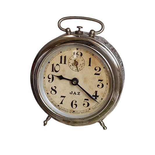 Small vintage mechanical alarm clock by French company Jaz with silver colored, chrome case