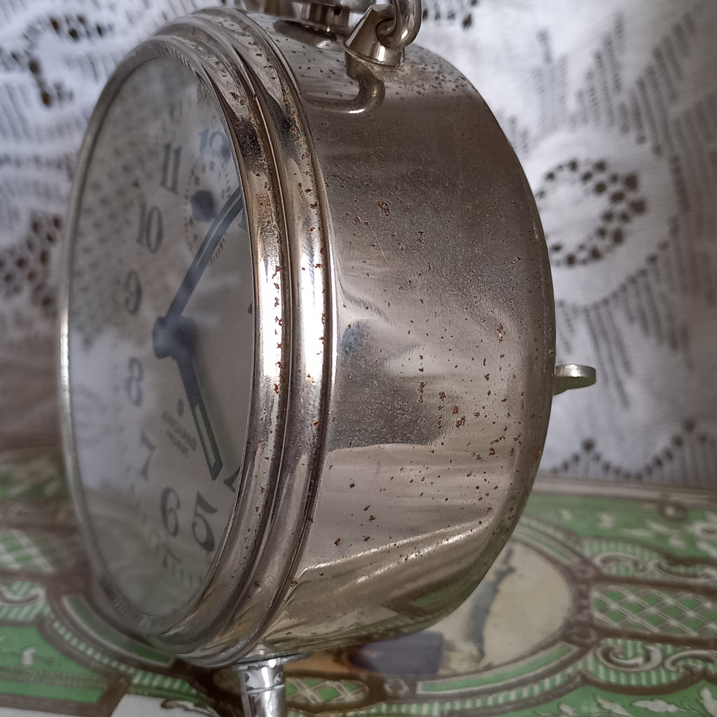 Small mechanical alarm clock with a chrome metal case by German company Junghans, office desk decor,