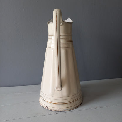 Large antique enamel metal pitcher in cream color with gold trim from France