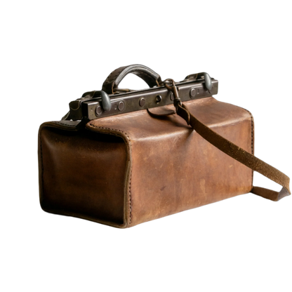 A French vintage leather shoulder/hand bag that's both practical and perfect as a prop or decorative piece in your interior, a beautifully aged piece with just enough patina of age to give it that authentic character. We have polished the distressed leather and thoroughly cleaned the bag both inside and out.