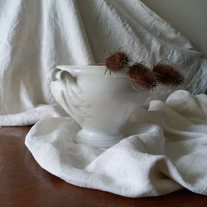 A large vintage white lidless tureen with decorative oak leaf handles made from heavy porcelain. This impressive-looking tureen makes an eye-catching piece of interior decor and is perfect as a fruit bowl.