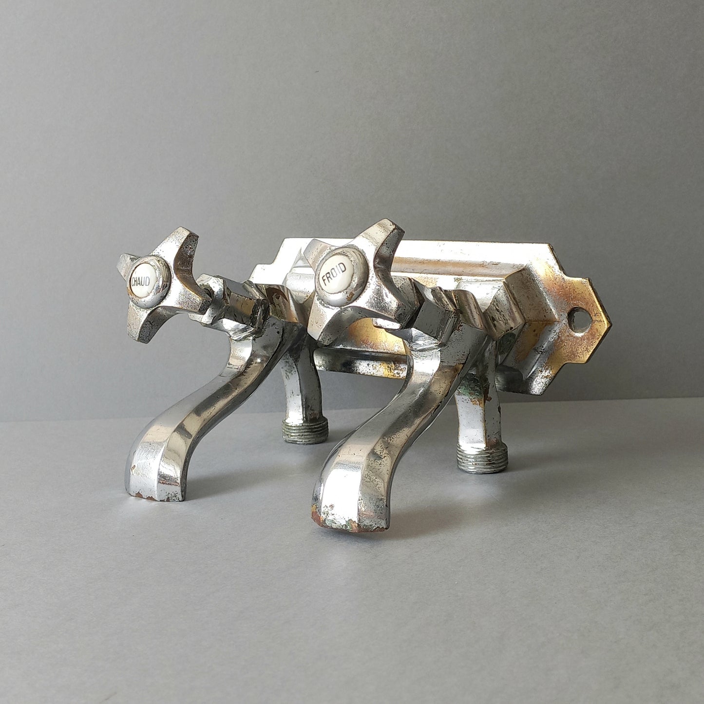 French vintage hot and cold faucet taps that are heavy, quality pieces being sold as a restoration piece or project.