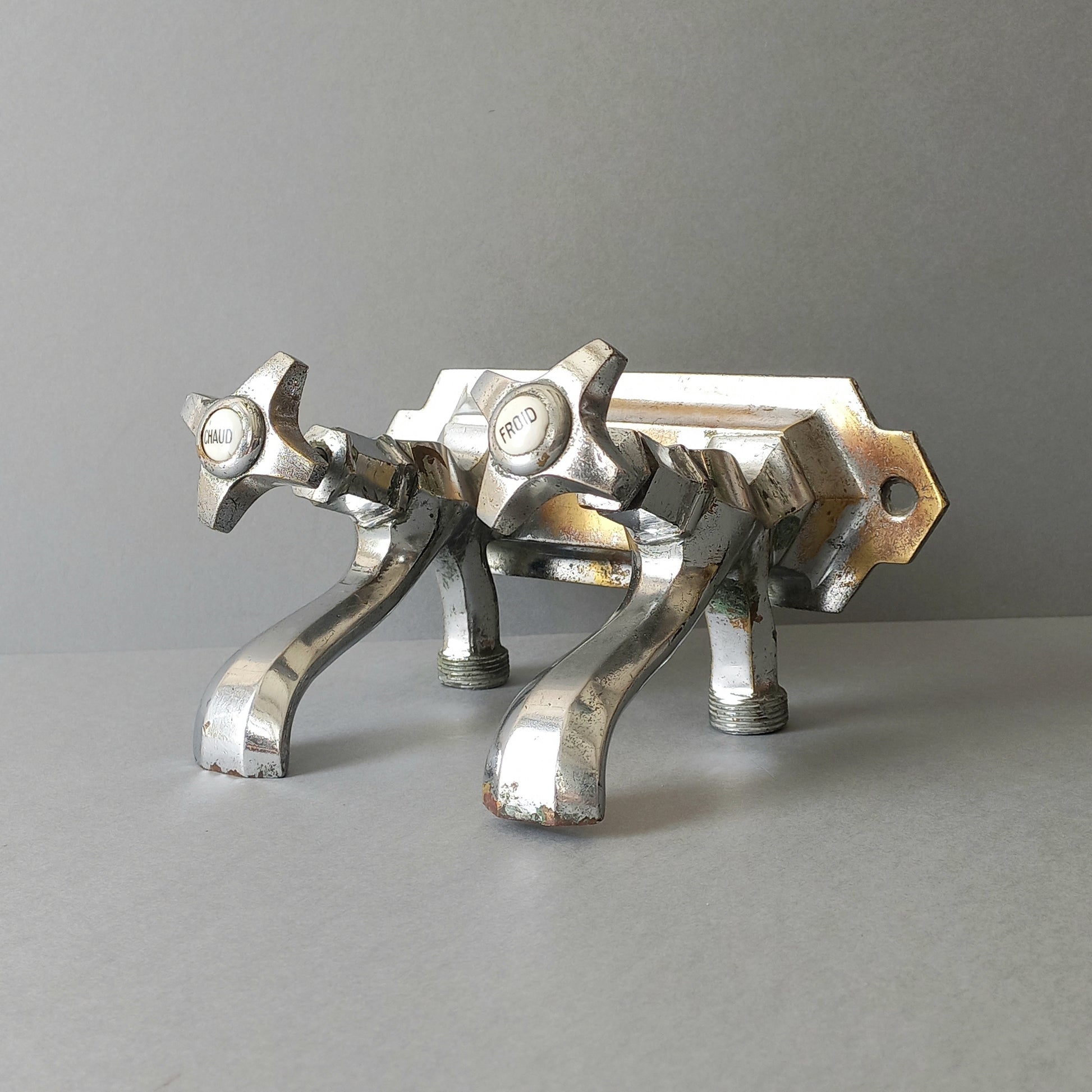 French vintage hot and cold faucet taps that are heavy, quality pieces being sold as a restoration piece or project.