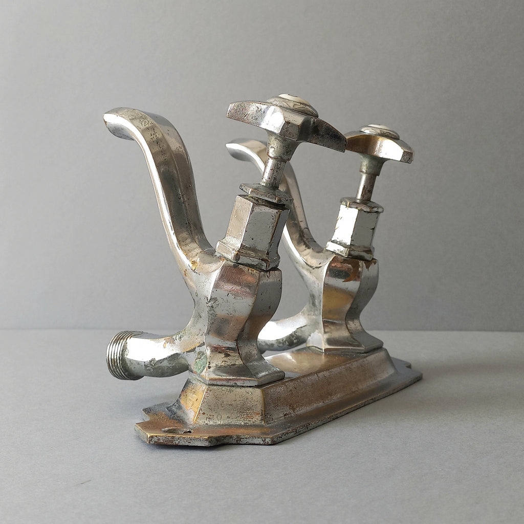 French vintage hot and cold faucet taps that are heavy, quality pieces being sold as a restoration piece or project.
