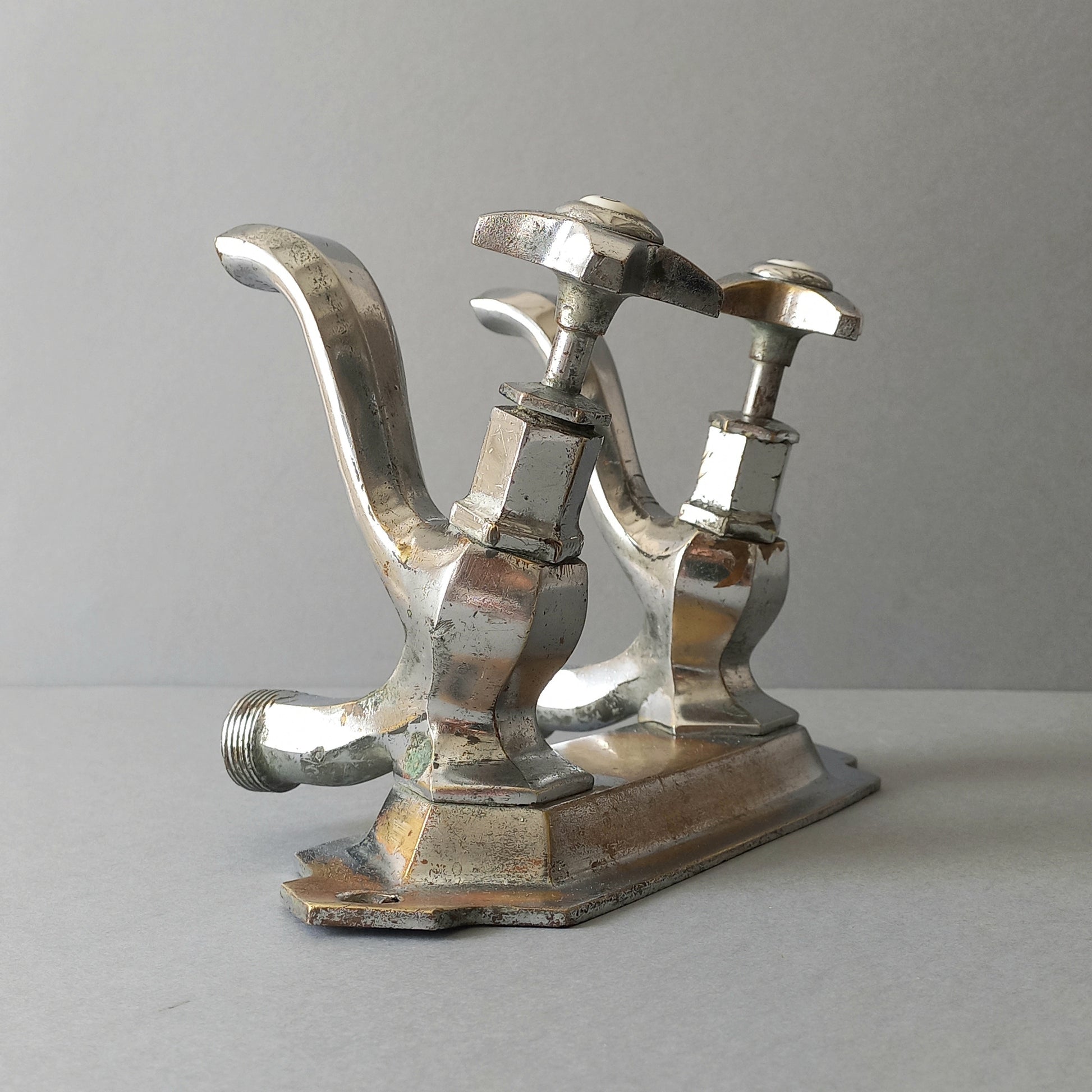 French vintage hot and cold faucet taps that are heavy, quality pieces being sold as a restoration piece or project.
