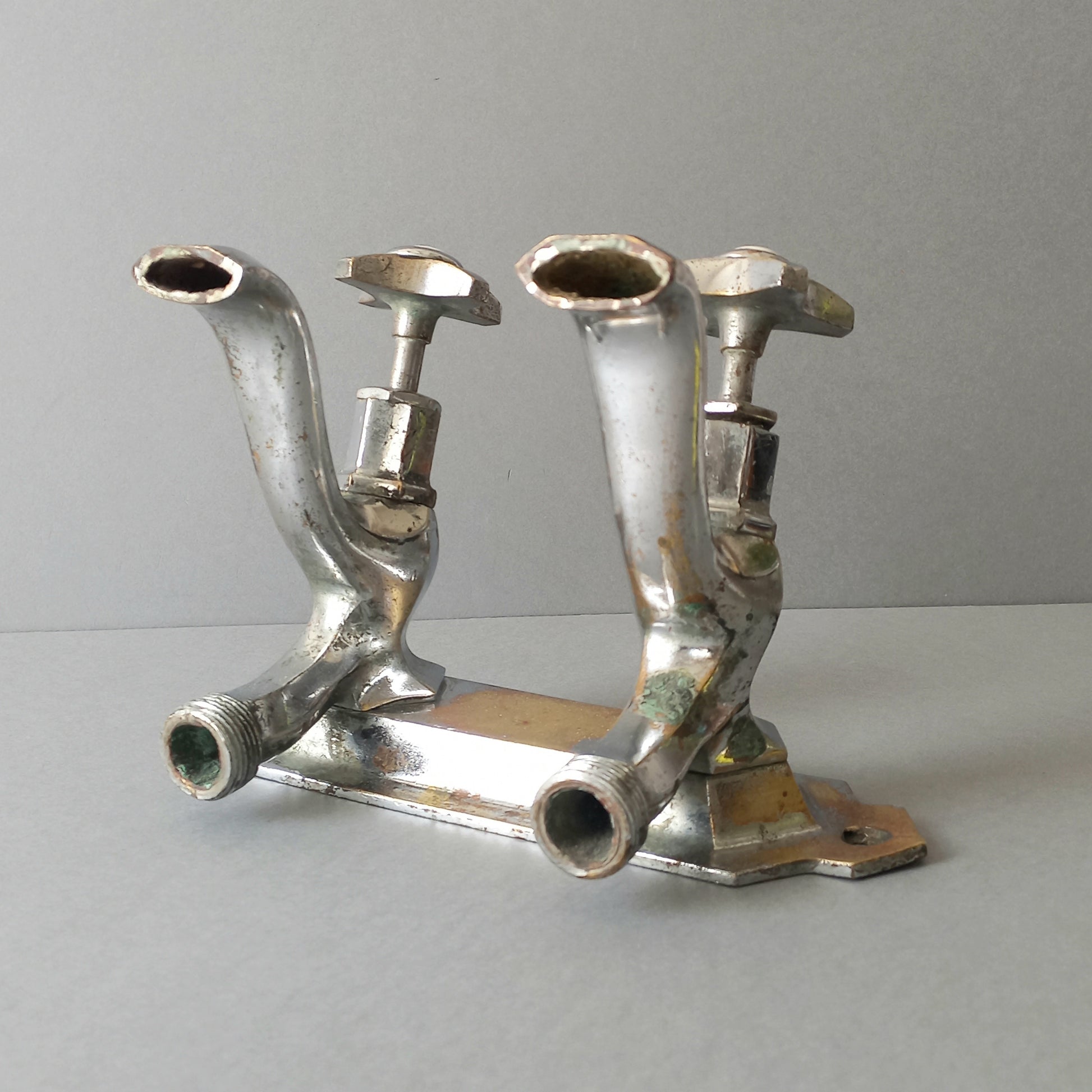 French vintage hot and cold faucet taps that are heavy, quality pieces being sold as a restoration piece or project.