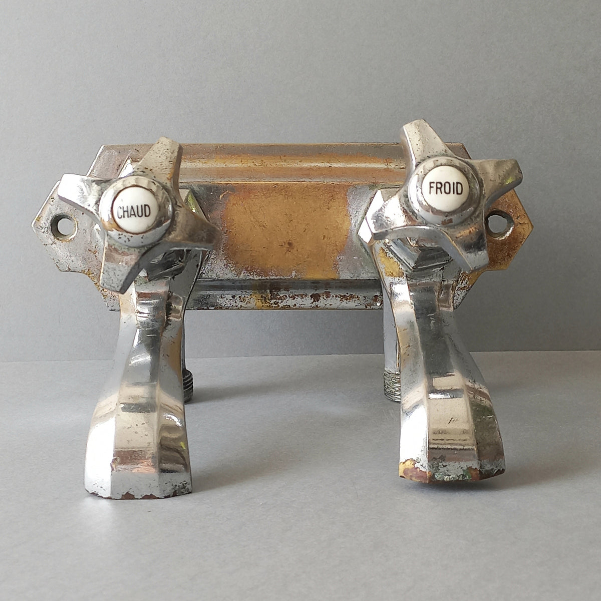 French vintage hot and cold faucet taps that are heavy, quality pieces being sold as a restoration piece or project.