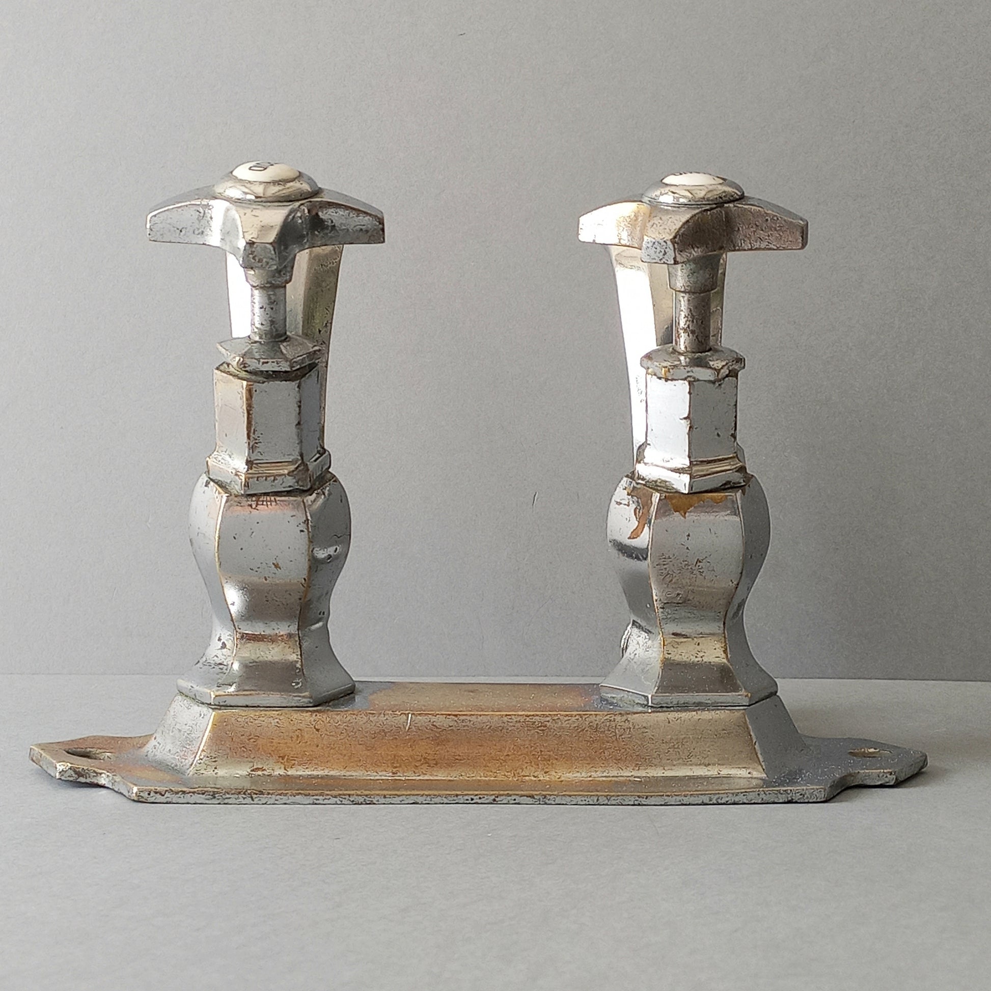 French vintage hot and cold faucet taps that are heavy, quality pieces being sold as a restoration piece or project.