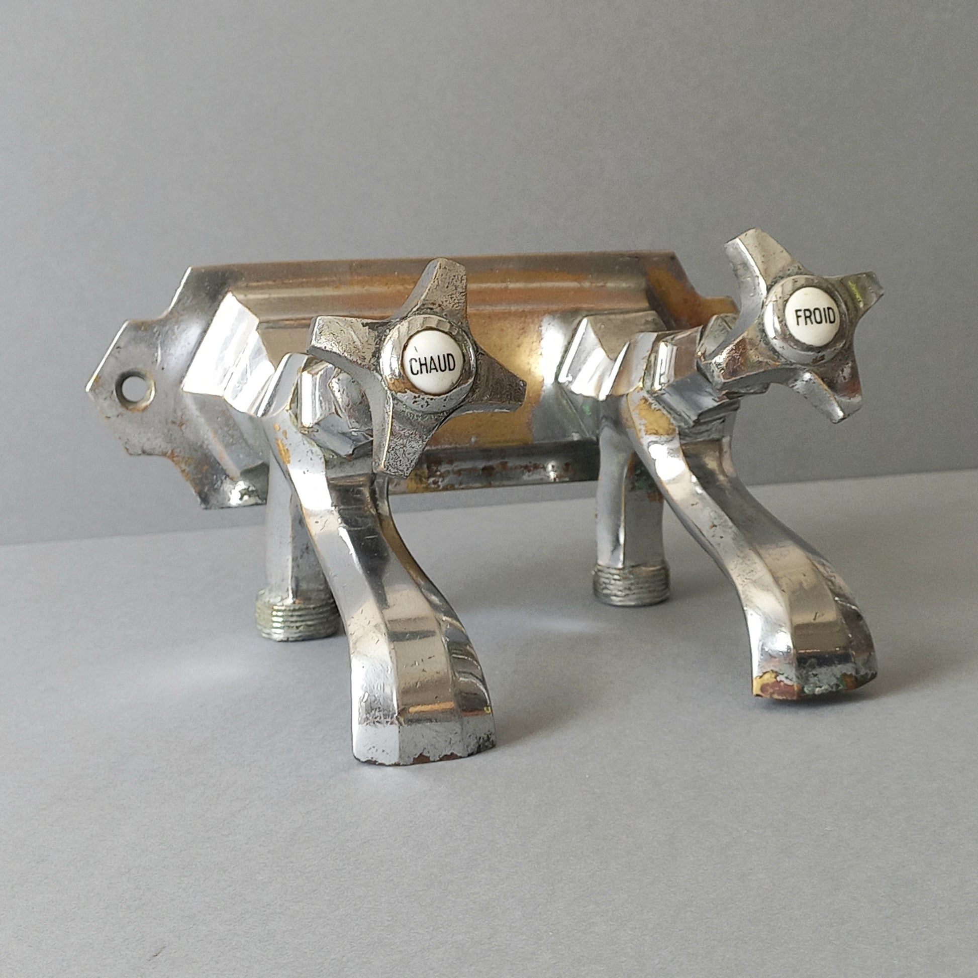 French vintage hot and cold faucet taps that are heavy, quality pieces being sold as a restoration piece or project.