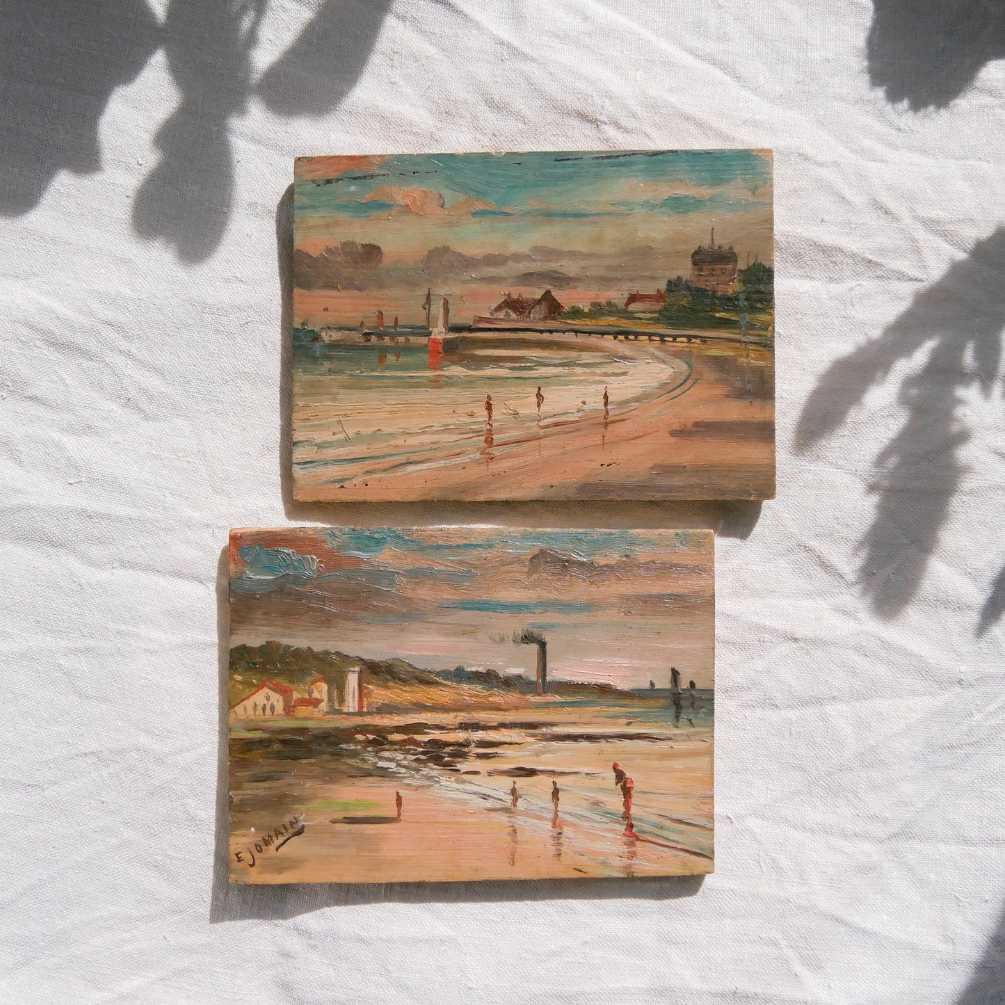 A beautiful pair of small coastal beach paintings on little wooden boards. Each original painting is wonderfully rendered with delightful and moody colours. The artist has signed one painting.

These original pieces of art look great displayed against a wall or on a mantelpiece, etc, and would also look equally nice on miniature easels as seen in two of our photos, or framed and on the wall - many possibilities!