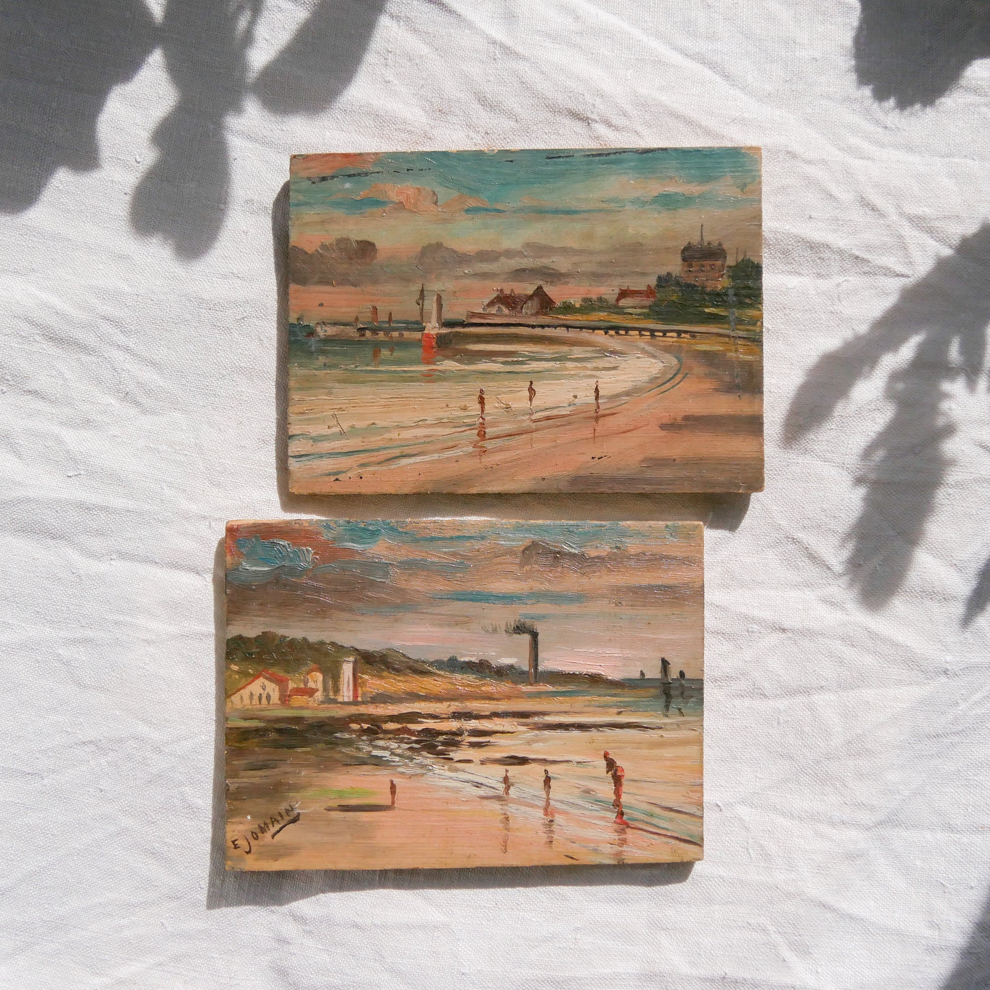 A beautiful pair of small coastal beach paintings on little wooden boards. Each original painting is wonderfully rendered with delightful and moody colours. The artist has signed one painting.

These original pieces of art look great displayed against a wall or on a mantelpiece, etc, and would also look equally nice on miniature easels as seen in two of our photos, or framed and on the wall - many possibilities!