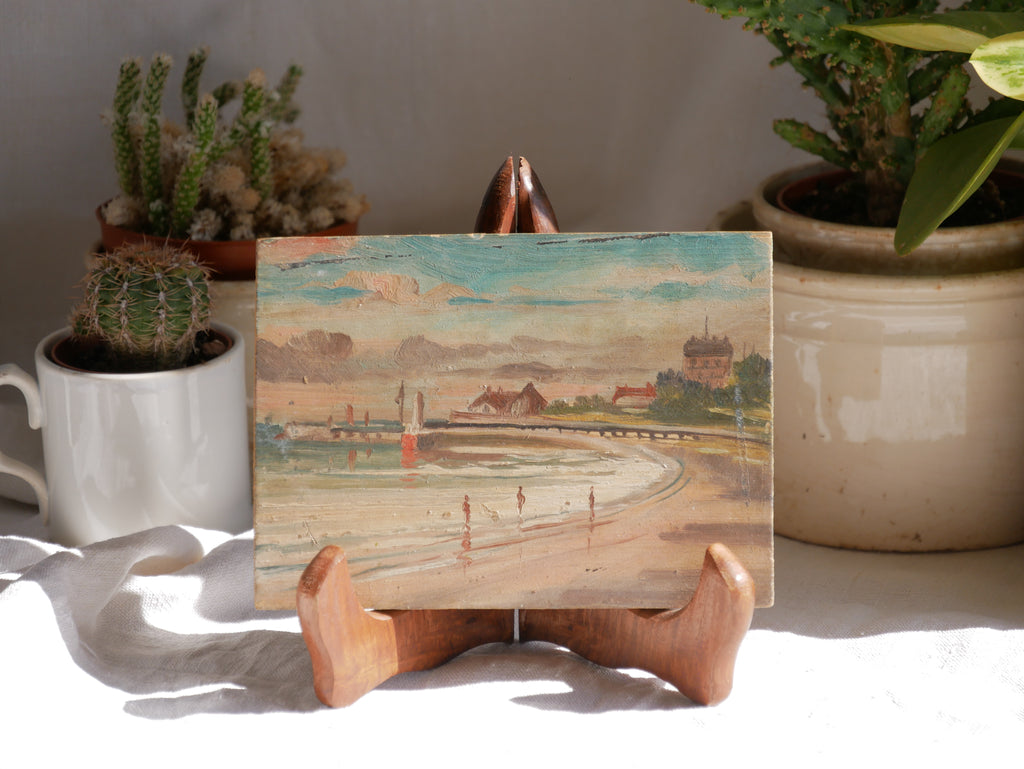 A beautiful pair of small coastal beach paintings on little wooden boards. Each original painting is wonderfully rendered with delightful and moody colours. The artist has signed one painting.

These original pieces of art look great displayed against a wall or on a mantelpiece, etc, and would also look equally nice on miniature easels as seen in two of our photos, or framed and on the wall - many possibilities!