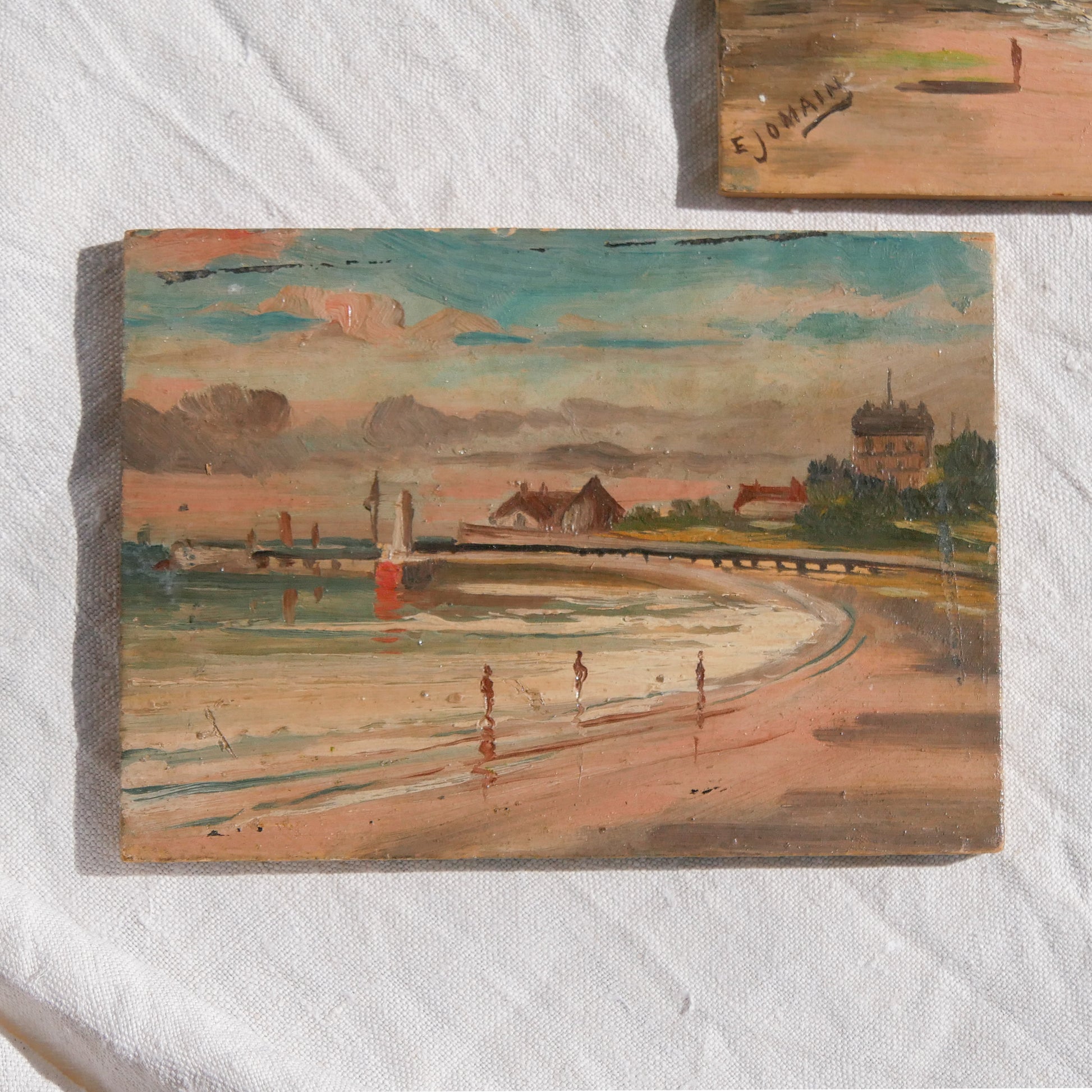 A beautiful pair of small coastal beach paintings on little wooden boards. Each original painting is wonderfully rendered with delightful and moody colours. The artist has signed one painting.

These original pieces of art look great displayed against a wall or on a mantelpiece, etc, and would also look equally nice on miniature easels as seen in two of our photos, or framed and on the wall - many possibilities!
