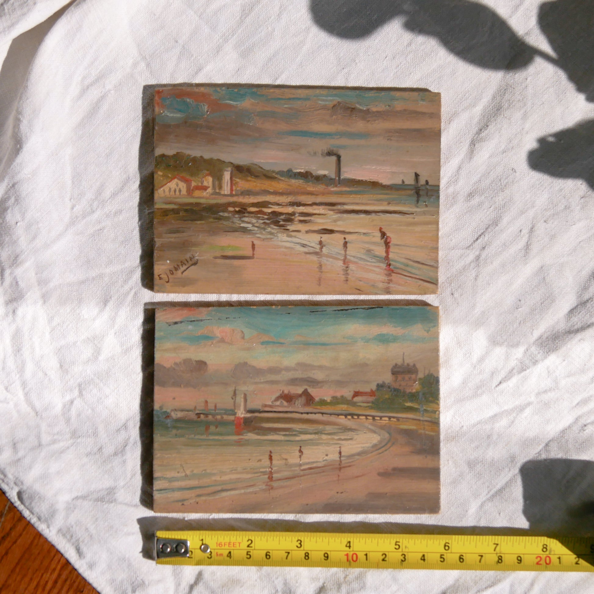 A beautiful pair of small coastal beach paintings on little wooden boards. Each original painting is wonderfully rendered with delightful and moody colours. The artist has signed one painting.

These original pieces of art look great displayed against a wall or on a mantelpiece, etc, and would also look equally nice on miniature easels as seen in two of our photos, or framed and on the wall - many possibilities!