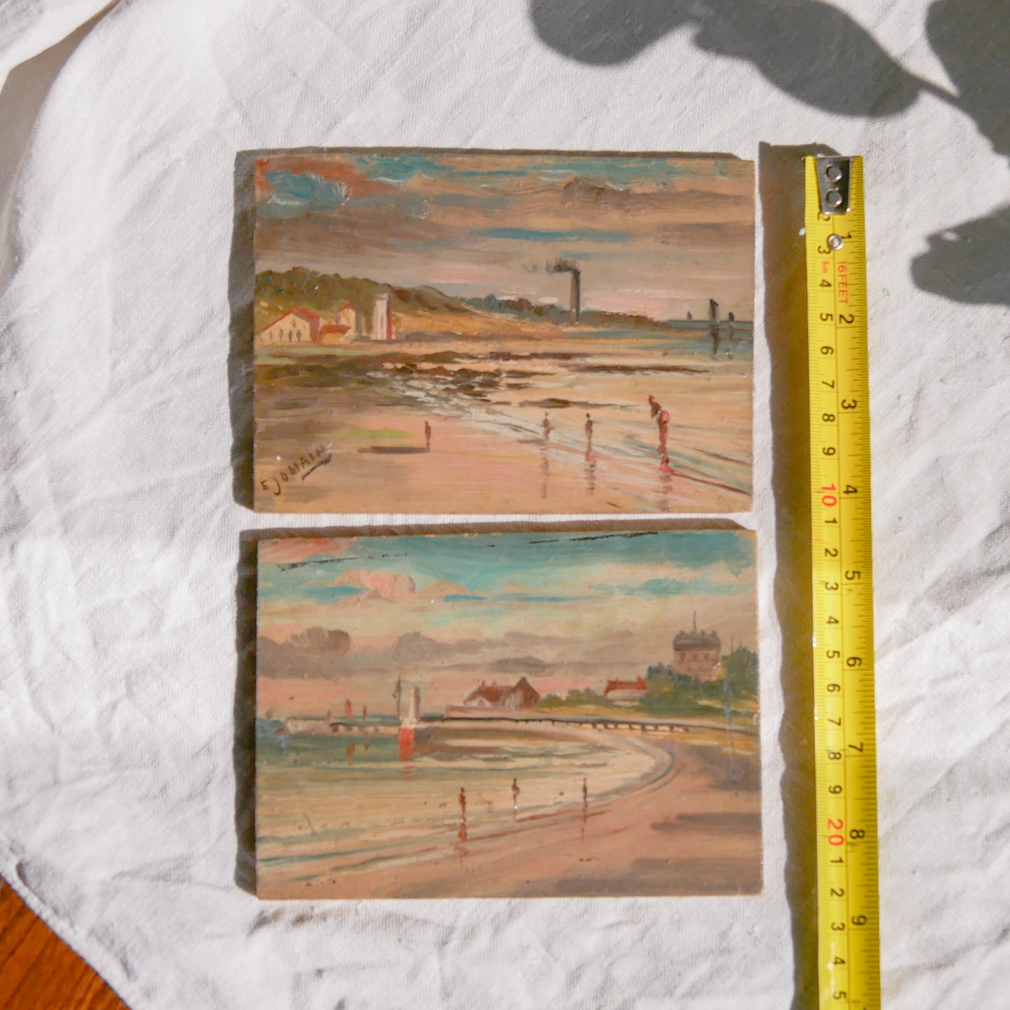 A beautiful pair of small coastal beach paintings on little wooden boards. Each original painting is wonderfully rendered with delightful and moody colours. The artist has signed one painting.

These original pieces of art look great displayed against a wall or on a mantelpiece, etc, and would also look equally nice on miniature easels as seen in two of our photos, or framed and on the wall - many possibilities!
