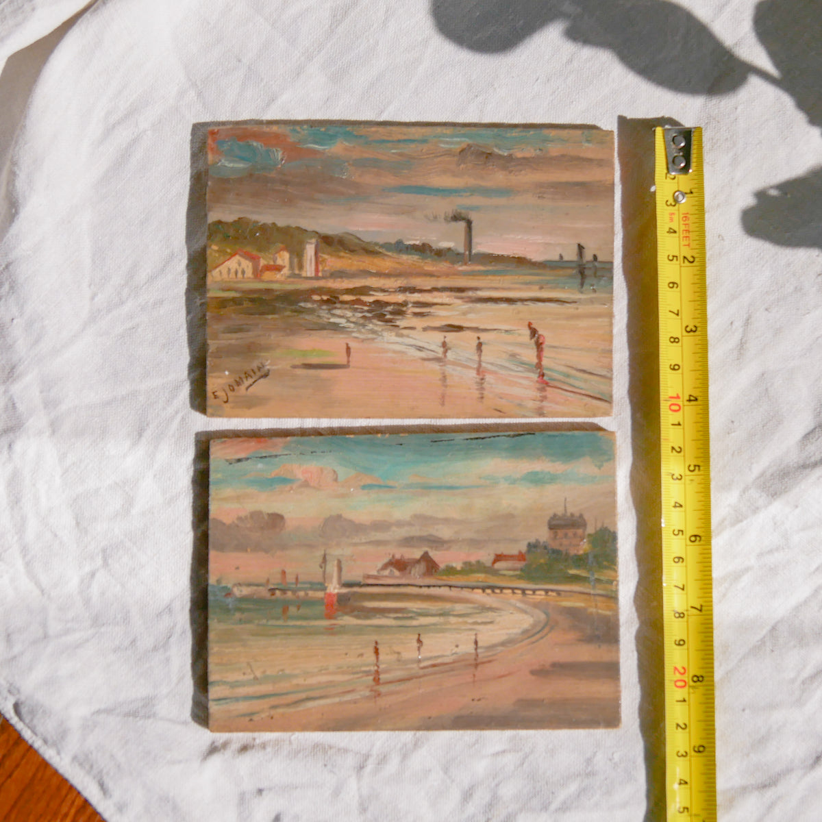 A beautiful pair of small coastal beach paintings on little wooden boards. Each original painting is wonderfully rendered with delightful and moody colours. The artist has signed one painting.

These original pieces of art look great displayed against a wall or on a mantelpiece, etc, and would also look equally nice on miniature easels as seen in two of our photos, or framed and on the wall - many possibilities!