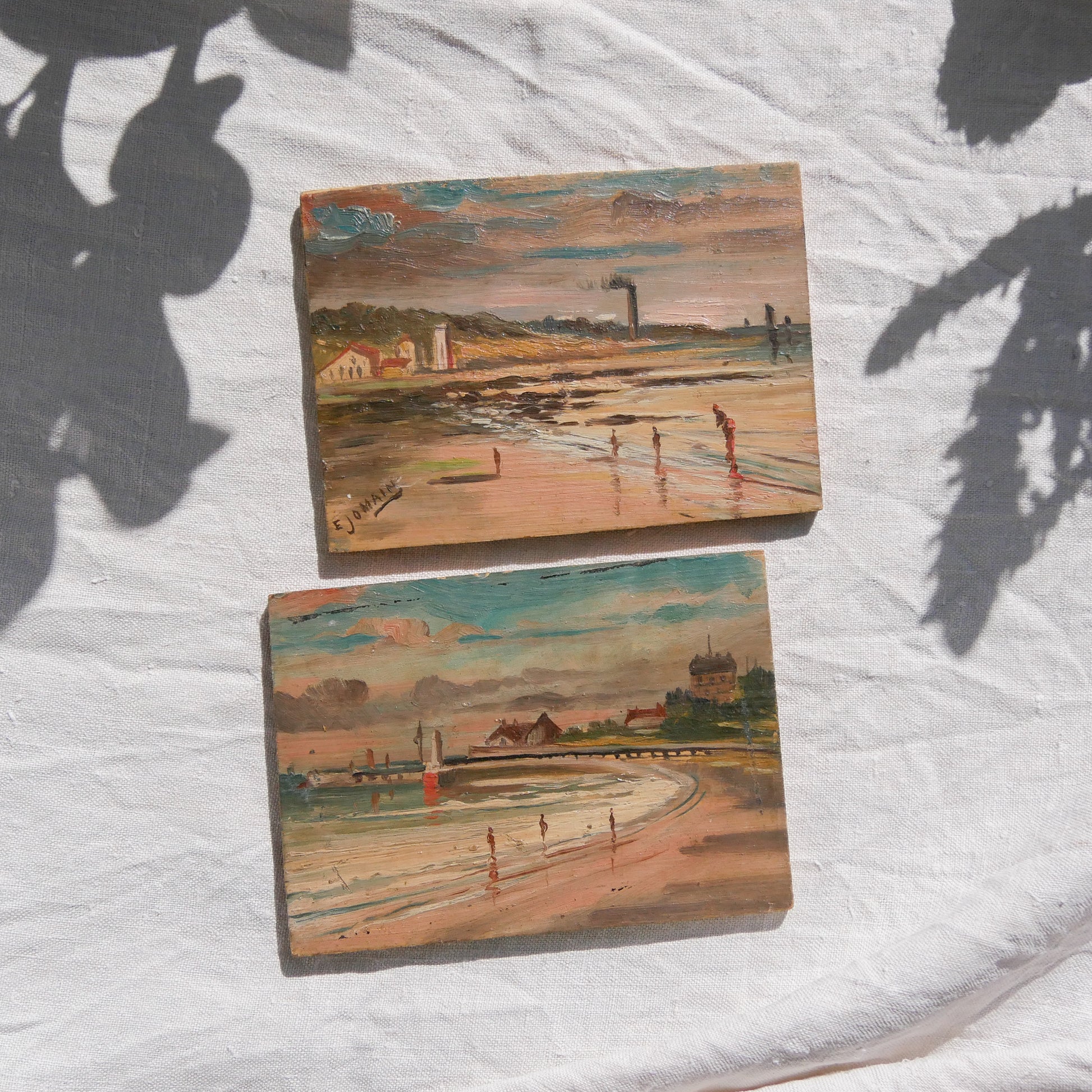 A beautiful pair of small coastal beach paintings on little wooden boards. Each original painting is wonderfully rendered with delightful and moody colours. The artist has signed one painting.

These original pieces of art look great displayed against a wall or on a mantelpiece, etc, and would also look equally nice on miniature easels as seen in two of our photos, or framed and on the wall - many possibilities!