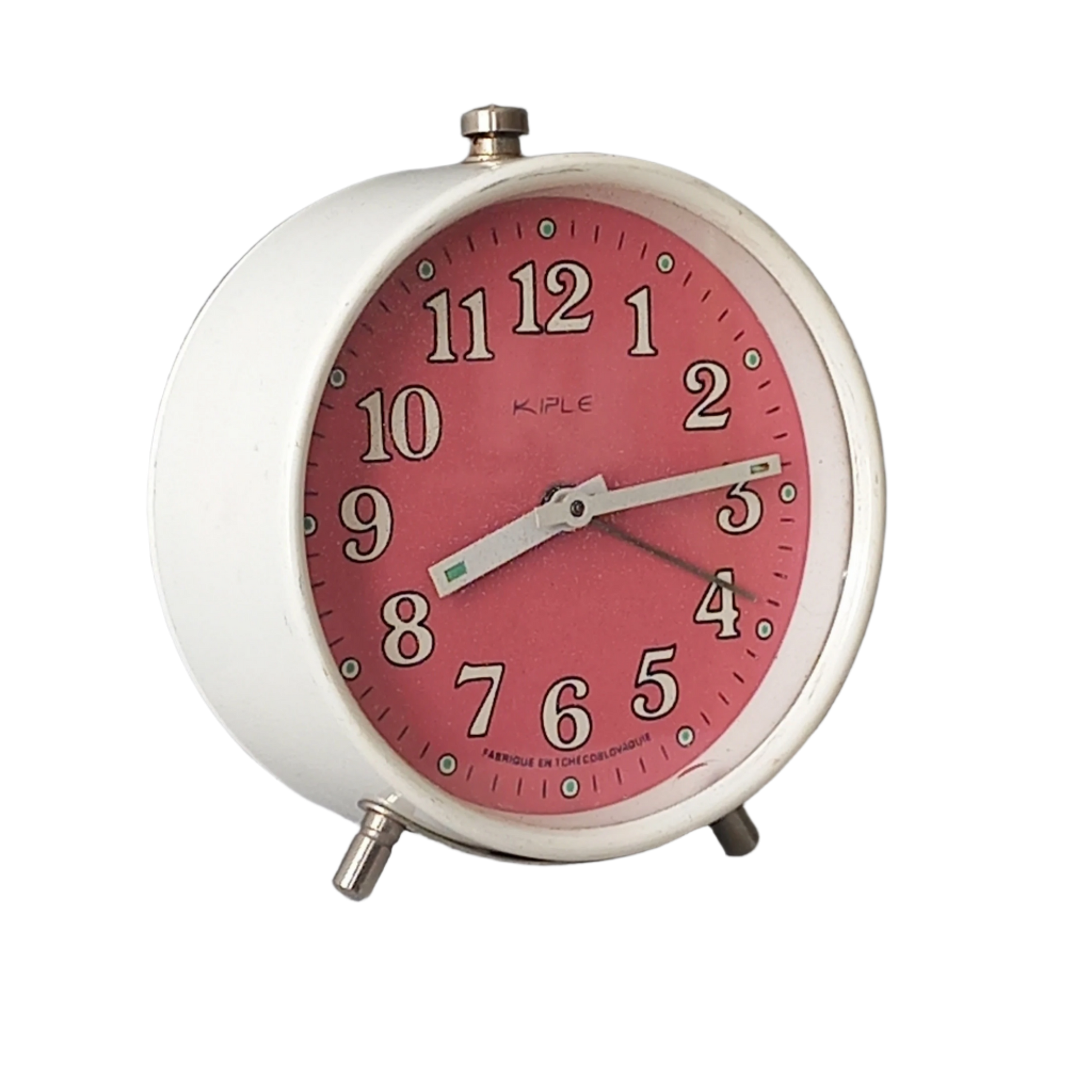 A vintage alarm clock in an eye-catching white and pink color scheme. This old clock is in working condition including the alarm and has a nice soothing ticking sound too. A great piece of European history from the former country of Czechoslovakia.

In summary, a nice vintage alarm clock!