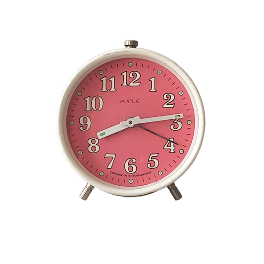 A vintage alarm clock in an eye-catching white and pink color scheme. This old clock is in working condition including the alarm and has a nice soothing ticking sound too. A great piece of European history from the former country of Czechoslovakia.

In summary, a nice vintage alarm clock!