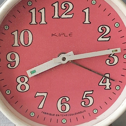 A wonderful vintage alarm clock in an eye-catching white and pink color scheme. This old clock is in working condition including the alarm and has a nice soothing ticking sound too. A great piece of European history from the former country of Czechoslovakia.