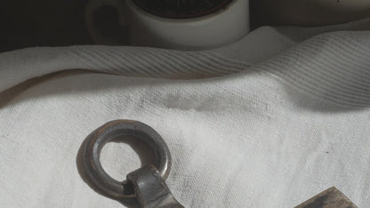 An interesting French antique artisan made Crucifix made from iron and painted black. On one side the metal has worn away in places giving this piece a pleasing patina of age. There's a hanging loop so it's ready to hang in your home.

We guesstimate this piece to be over 100 years old.