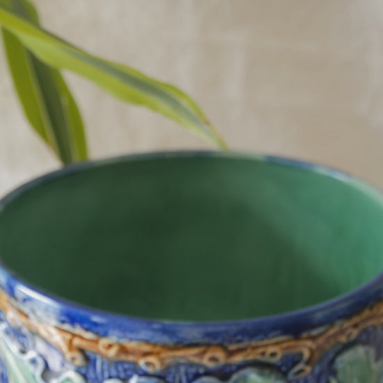 A stunning pair of French antique majolica planters, absolutely glorious fresh blue and green colours with oak leafs and acorns in relief making these stunning pieces of interior home decor wherever you decide to display them.

One of the planters has an antique repair in the form of metal staples that have been expertly done from the inside - in the 1800s and early 1900s this was quite a common repair to have made on items of high value and we feel it only adds to the authenticity/story of these pieces.