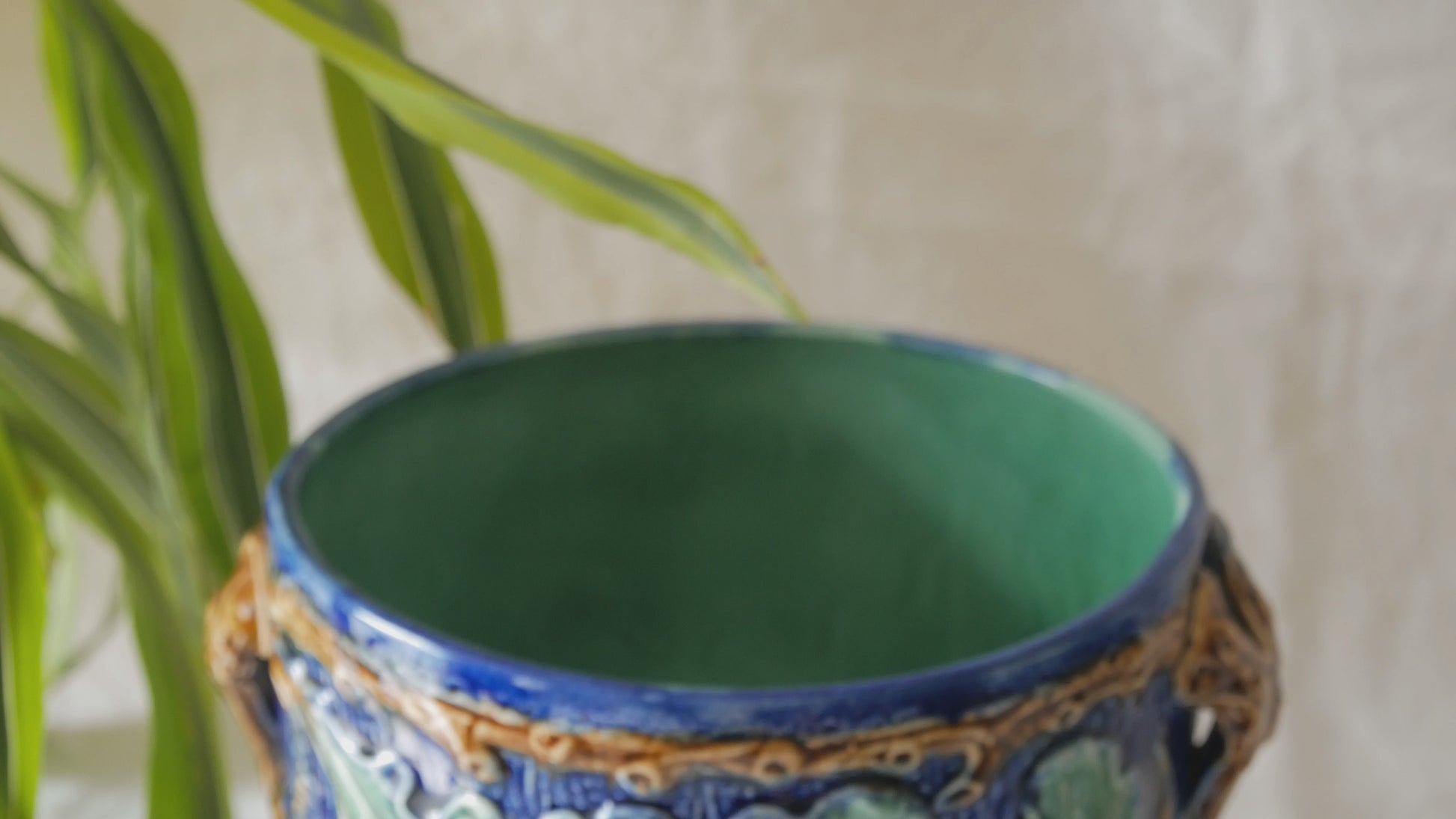 A stunning pair of French antique majolica planters, absolutely glorious fresh blue and green colours with oak leafs and acorns in relief making these stunning pieces of interior home decor wherever you decide to display them.

One of the planters has an antique repair in the form of metal staples that have been expertly done from the inside - in the 1800s and early 1900s this was quite a common repair to have made on items of high value and we feel it only adds to the authenticity/story of these pieces.