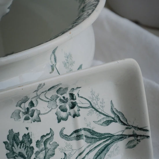 A French antique ironstone jug, basin and soap dish, printed in a soft teal-green bird-and-floral pattern. 