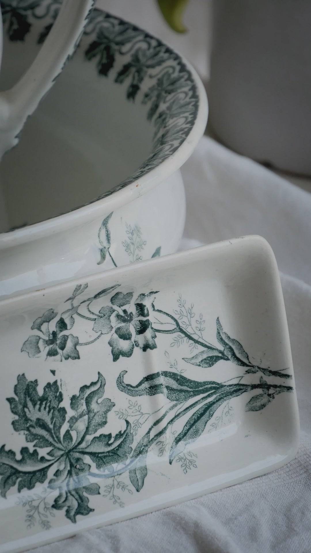 A French antique ironstone jug, basin and soap dish, printed in a soft teal-green bird-and-floral pattern. 