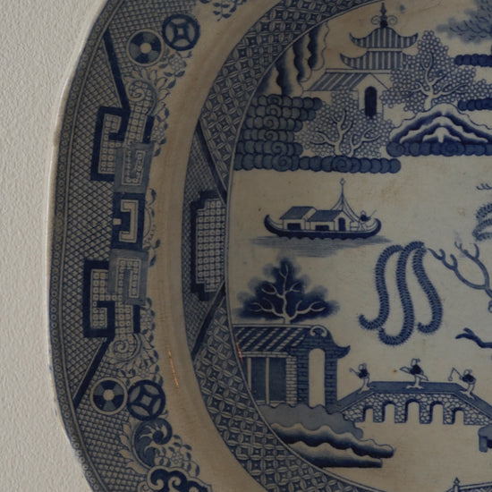 A very large and rare English antique serving willow-ware meat platter dish which dates from the Victorian period onward. This heavy platter is most likely stoneware/ironstone due to its weight. This plate is really an impressive piece that will be perfect decor for any collection.