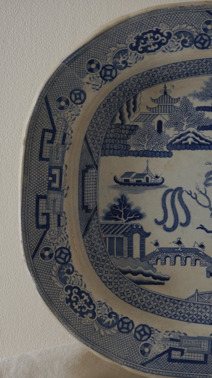 A very large and rare English antique serving willow-ware meat platter dish which dates from the Victorian period onward. This heavy platter is most likely stoneware/ironstone due to its weight. This plate is really an impressive piece that will be perfect decor for any collection.