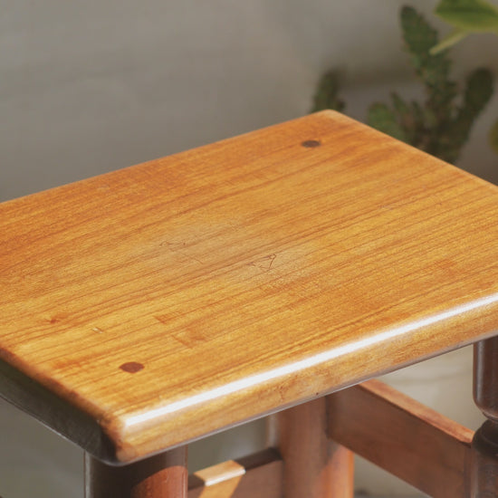 A handsome vintage French wooden stool in a lovely shade of honey-coloured brown. This old stool is very solid and would make a great plant stand (we currently use one on our desk as a plant stand and it looks great!) and many other decorative possibilities.