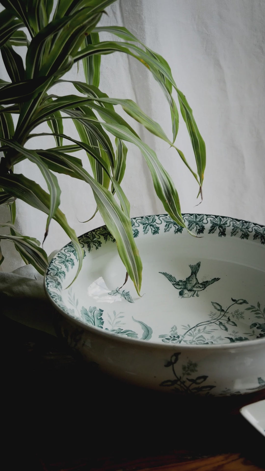 A French antique ironstone jug, basin and soap dish, printed in a soft teal-green bird-and-floral pattern. 