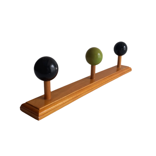 Vintage wooden coat rack with green and black pegs from France, retro wall mounted coat hanger