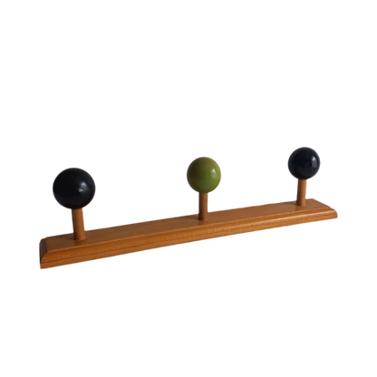 Vintage wooden coat rack with green and black pegs from France, retro wall mounted coat hanger