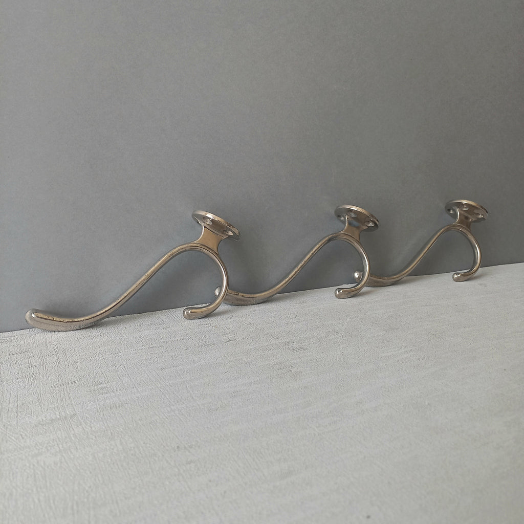 3 x French vintage silver coloured metal coat hooks in used sturdy used condition. Good for coat storage, dog leads, or maybe in the kitchen or bathroom for towels.
Circa. 1930s/1950s.