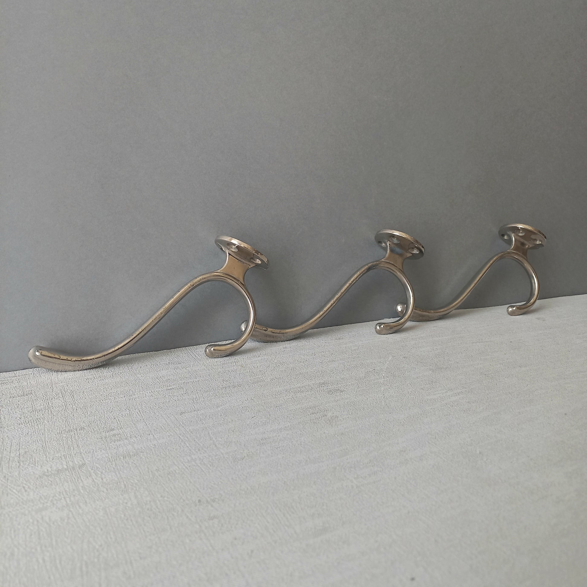 3 x French vintage silver coloured metal coat hooks in used sturdy used condition. Good for coat storage, dog leads, or maybe in the kitchen or bathroom for towels.
Circa. 1930s/1950s.