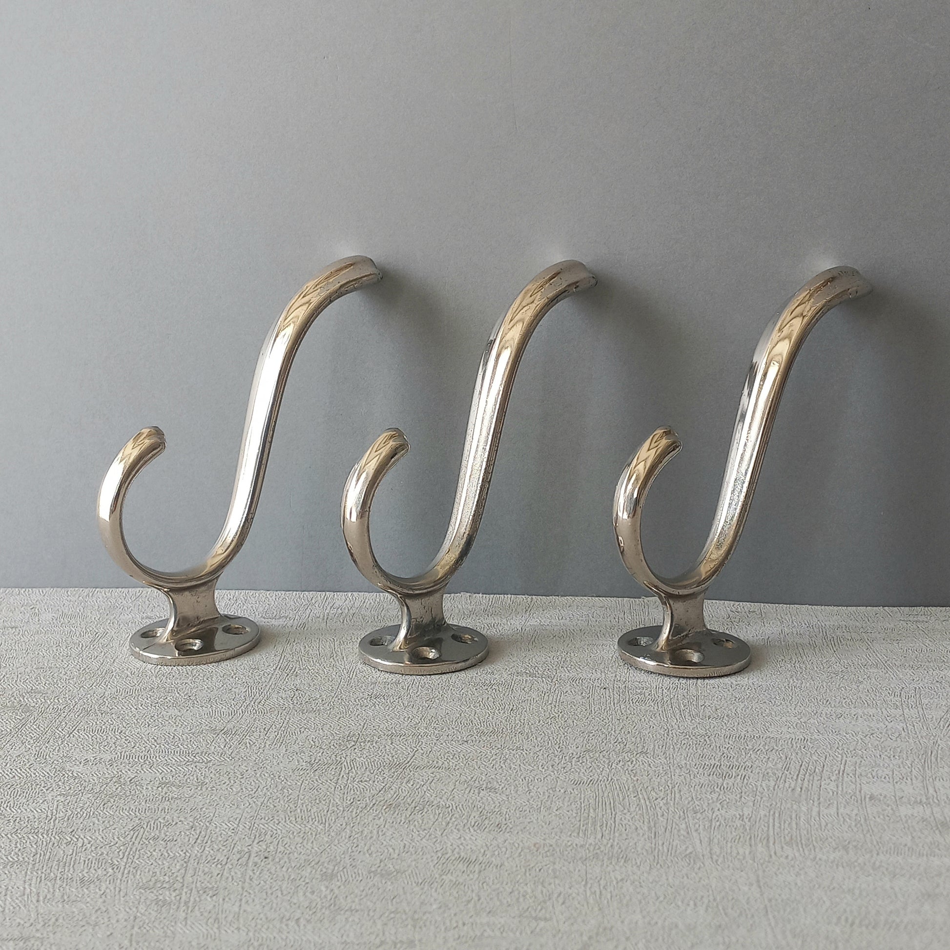 3 x French vintage silver coloured metal coat hooks in used sturdy used condition. Good for coat storage, dog leads, or maybe in the kitchen or bathroom for towels.
Circa. 1930s/1950s.