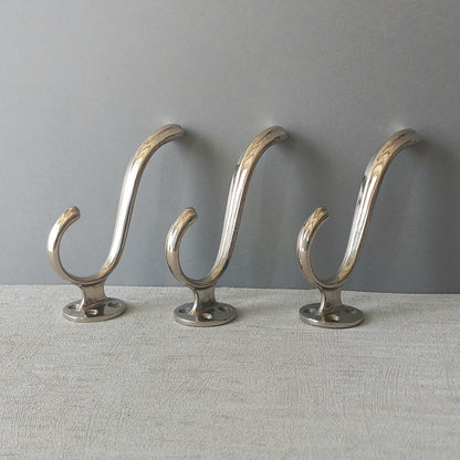 3 x French vintage silver coloured metal coat hooks in used sturdy used condition. Good for coat storage, dog leads, or maybe in the kitchen or bathroom for towels.
Circa. 1930s/1950s.
