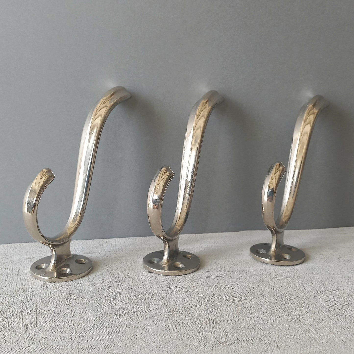 3 x French vintage silver coloured metal coat hooks in used sturdy used condition. Good for coat storage, dog leads, or maybe in the kitchen or bathroom for towels.
Circa. 1930s/1950s.