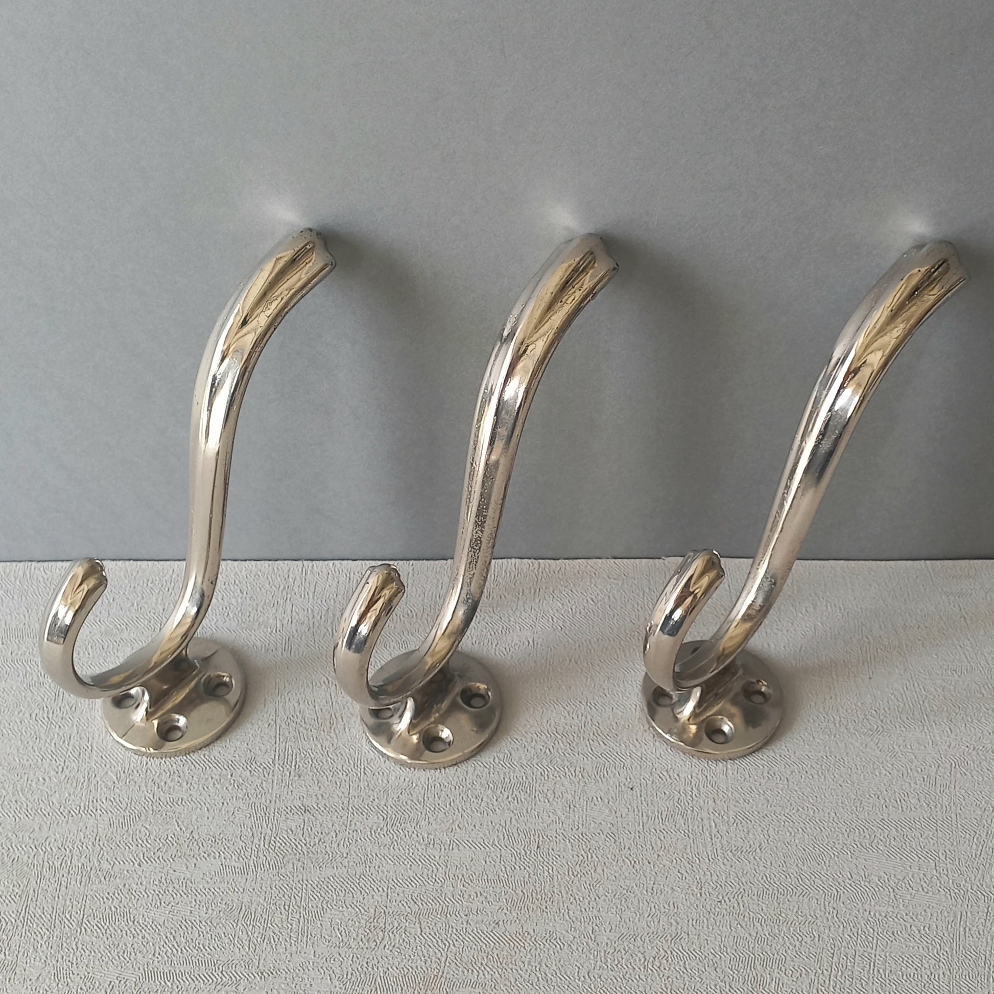 3 x French vintage silver coloured metal coat hooks in used sturdy used condition. Good for coat storage, dog leads, or maybe in the kitchen or bathroom for towels.
Circa. 1930s/1950s.