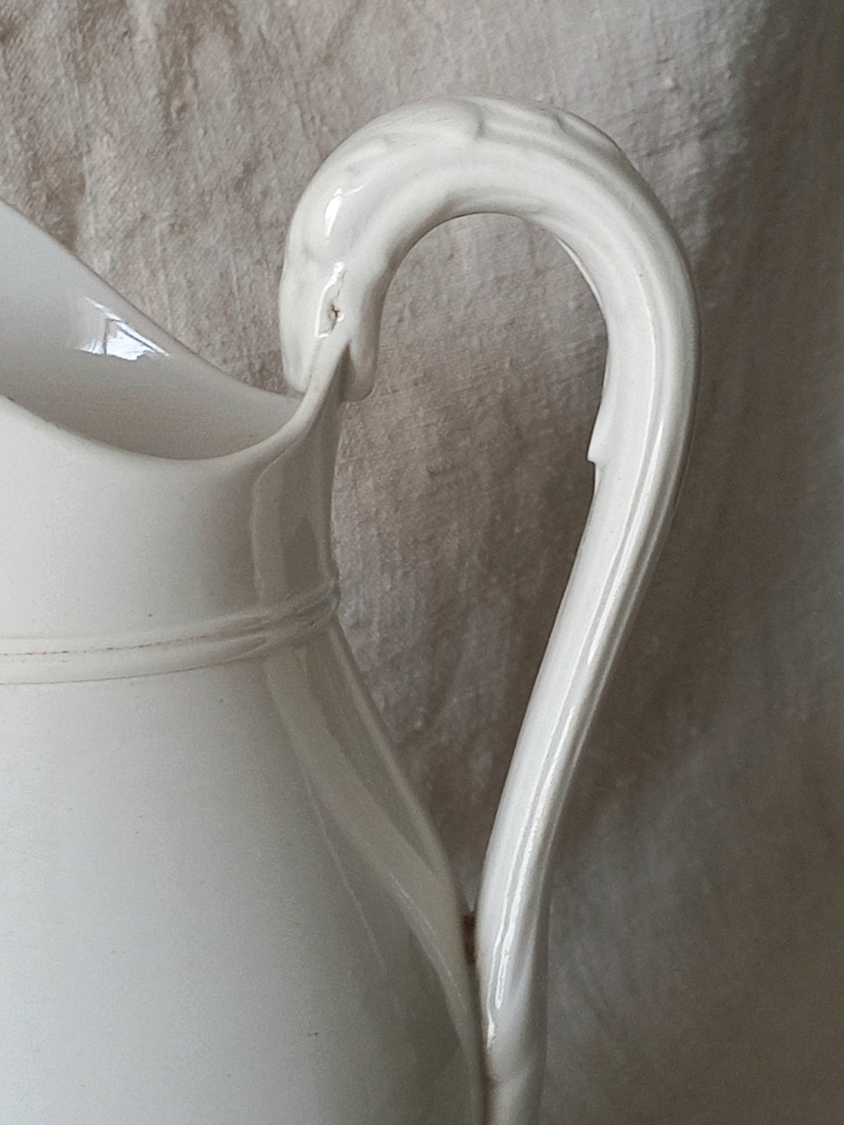 Small antique white ironstone/earthenware jug by premier French manufacturer, Sarreguemines.