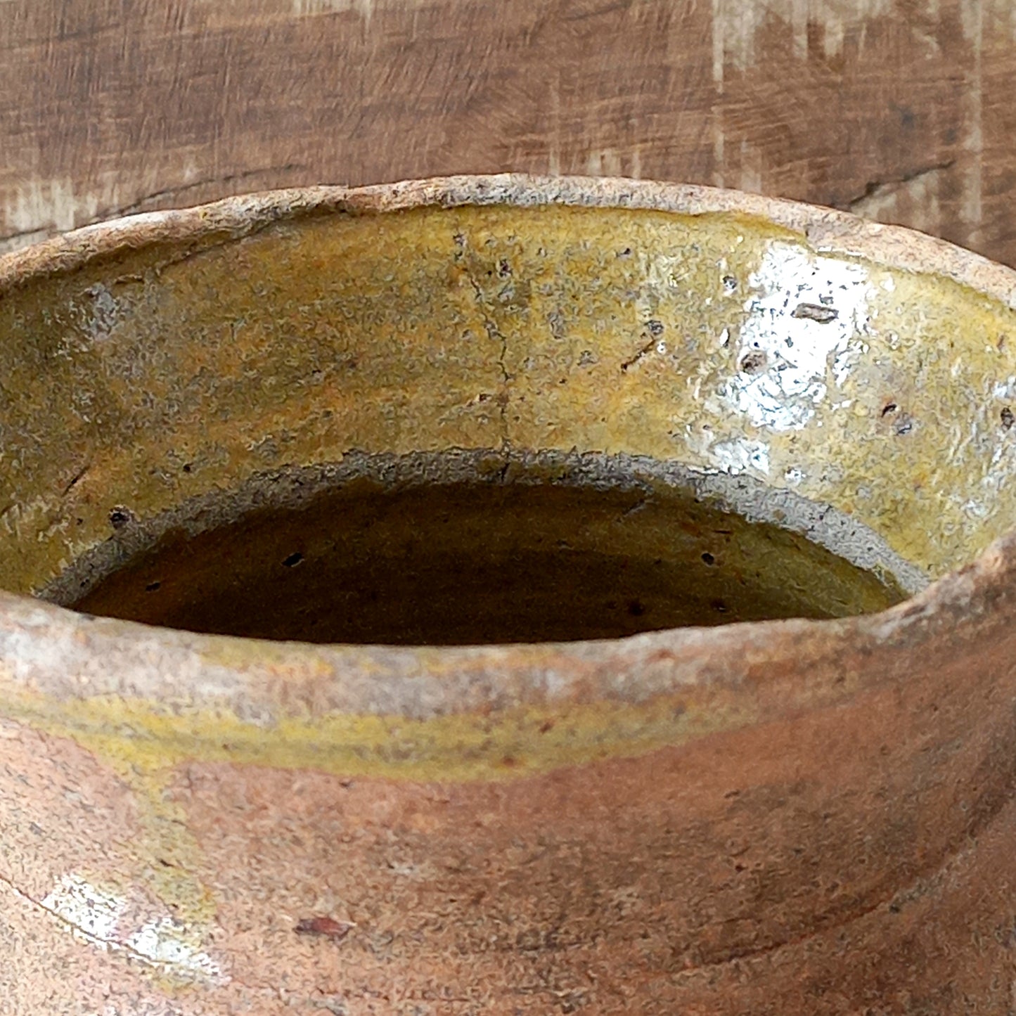 A little antique stoneware jug with a glazed interior in a wonderful shade of ochre, so rustic! This piece of pottery has aged beautifully and with its uneven worn edges and earthy rough texture it's perfect for a rustic, country or farmhouse interior.