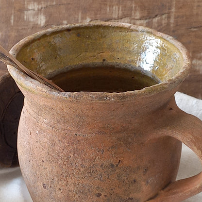 A little antique stoneware jug with a glazed interior in a wonderful shade of ochre, so rustic! This piece of pottery has aged beautifully and with its uneven worn edges and earthy rough texture it's perfect for a rustic, country or farmhouse interior.