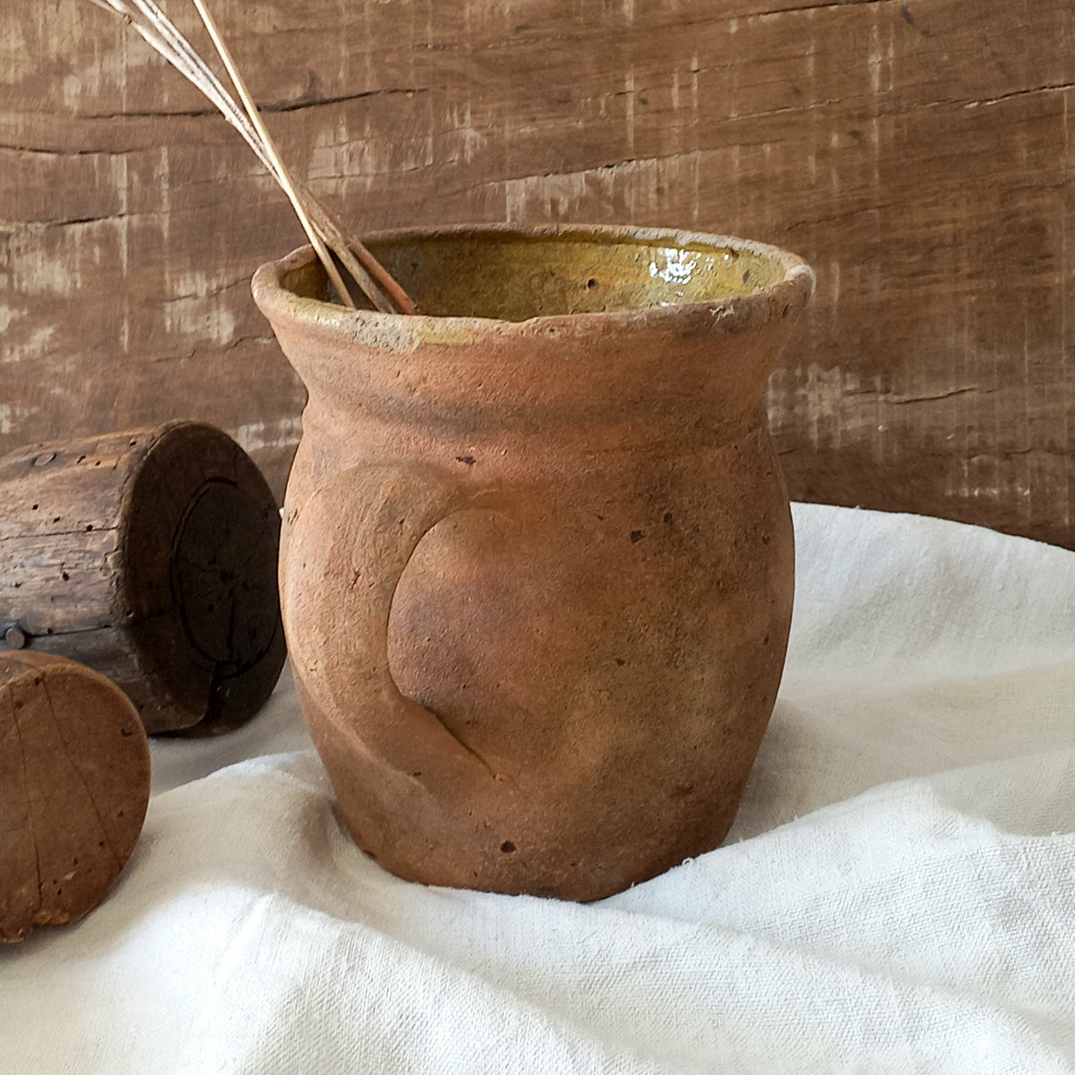 A little antique stoneware jug with a glazed interior in a wonderful shade of ochre, so rustic! This piece of pottery has aged beautifully and with its uneven worn edges and earthy rough texture it's perfect for a rustic, country or farmhouse interior.