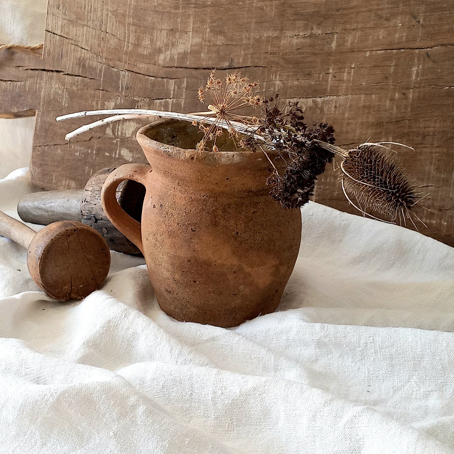 A little antique stoneware jug with a glazed interior in a wonderful shade of ochre, so rustic! This piece of pottery has aged beautifully and with its uneven worn edges and earthy rough texture it's perfect for a rustic, country or farmhouse interior.