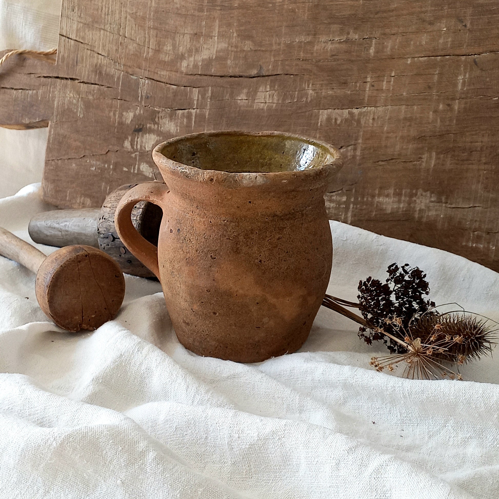 A little antique stoneware jug with a glazed interior in a wonderful shade of ochre, so rustic! This piece of pottery has aged beautifully and with its uneven worn edges and earthy rough texture it's perfect for a rustic, country or farmhouse interior.