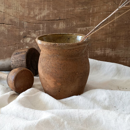 A little antique stoneware jug with a glazed interior in a wonderful shade of ochre, so rustic! This piece of pottery has aged beautifully and with its uneven worn edges and earthy rough texture it's perfect for a rustic, country or farmhouse interior.