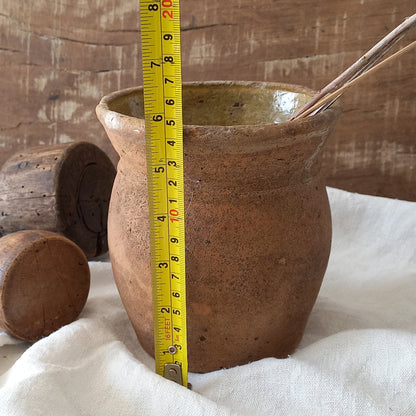 A little antique stoneware jug with a glazed interior in a wonderful shade of ochre, so rustic! This piece of pottery has aged beautifully and with its uneven worn edges and earthy rough texture it's perfect for a rustic, country or farmhouse interior.